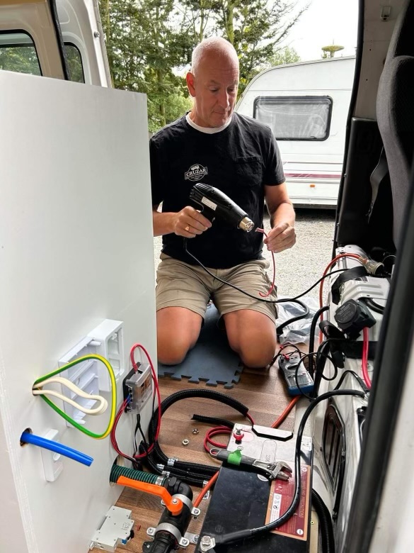 Cruzar Custom Campervans co-owner Andy at work on a campervan conversion