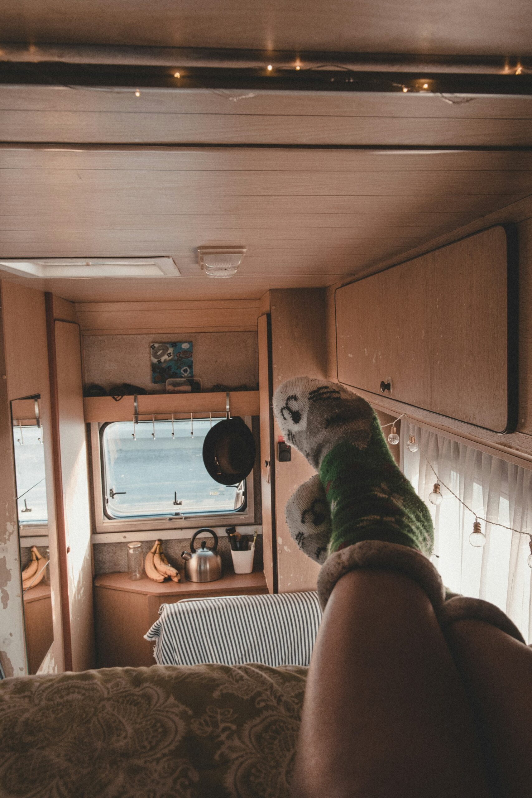 Feet dangling out of a campervan door