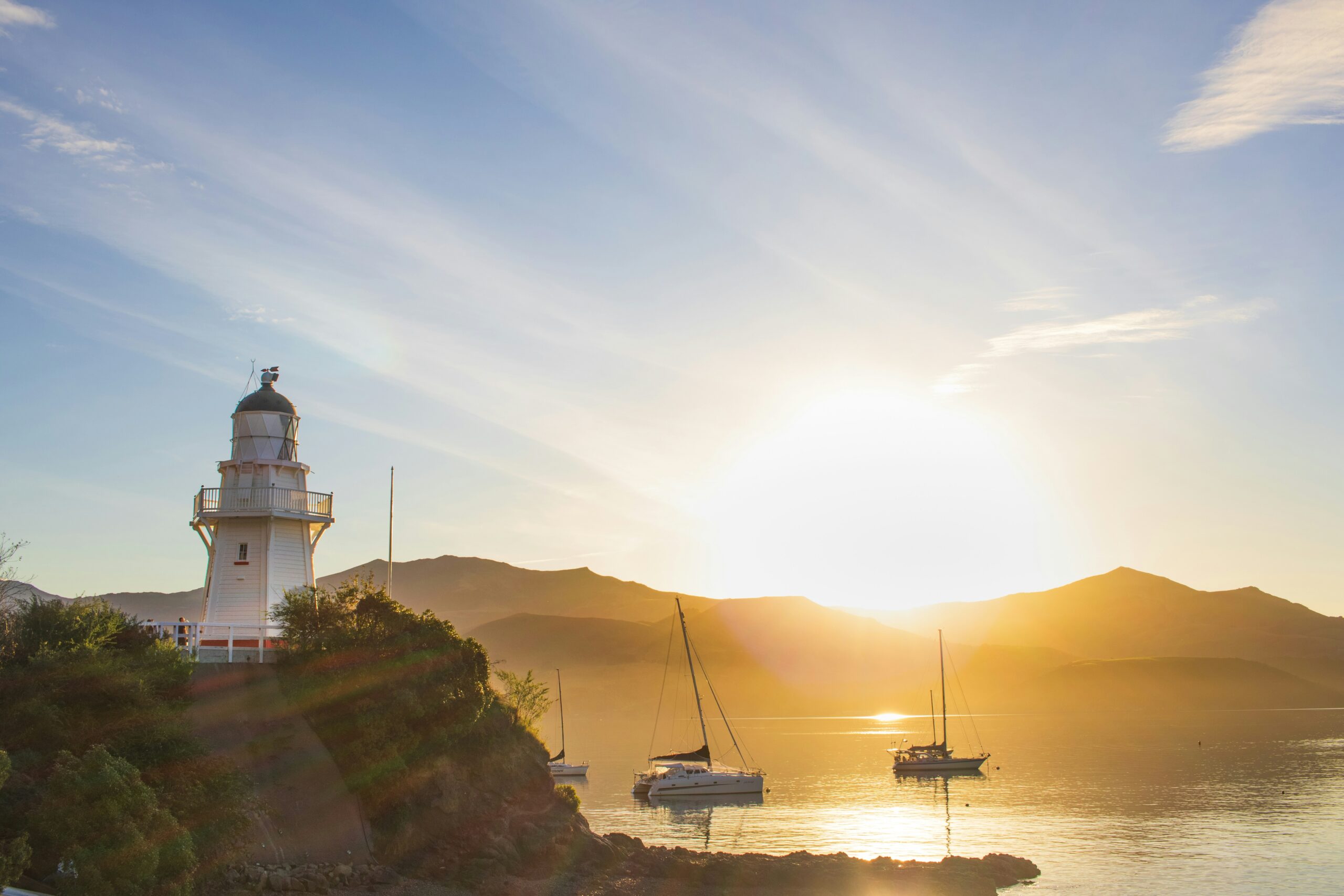 Akaroa lighthouse and harbour at sunset