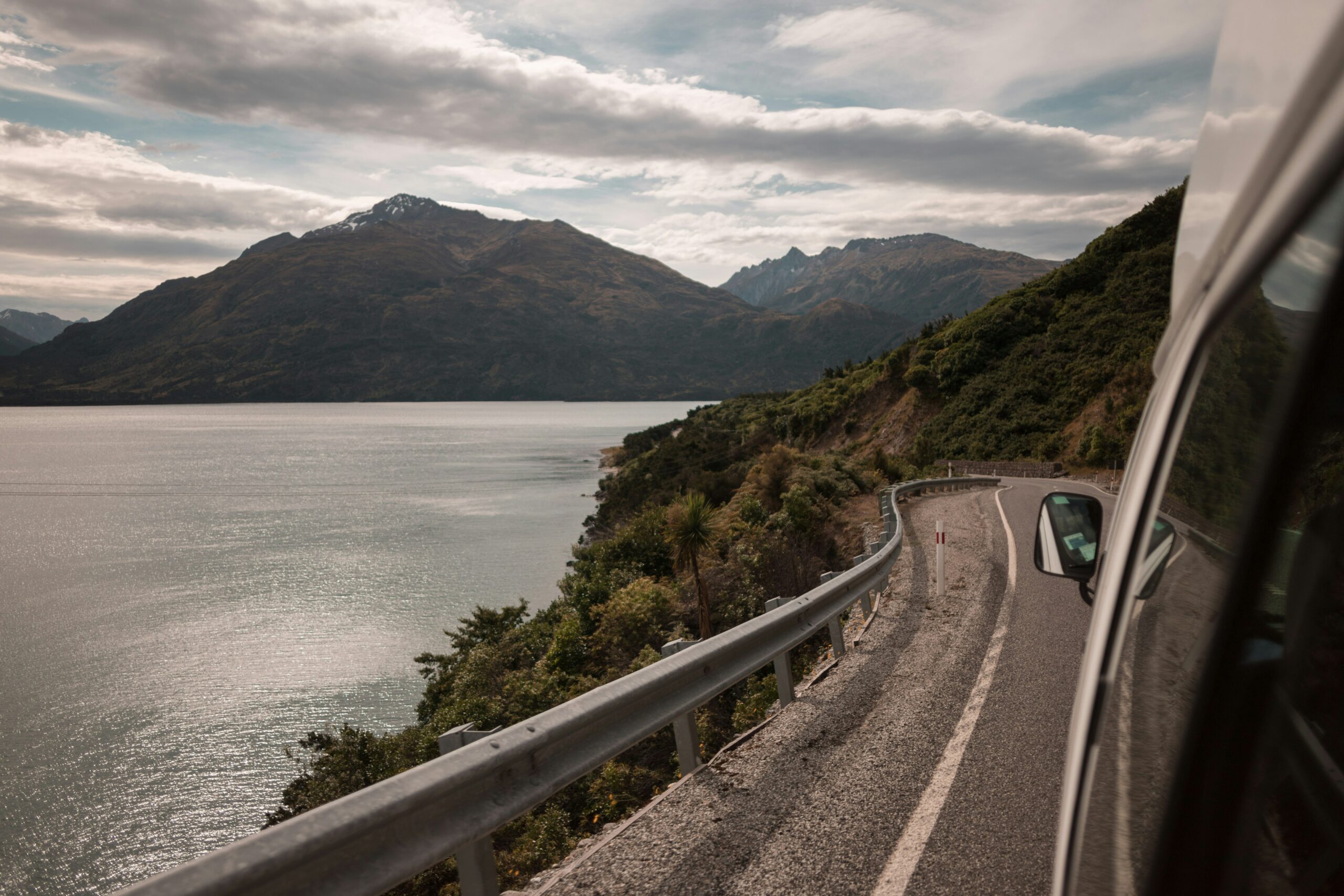 A scenic New Zealand highway curving through green hills