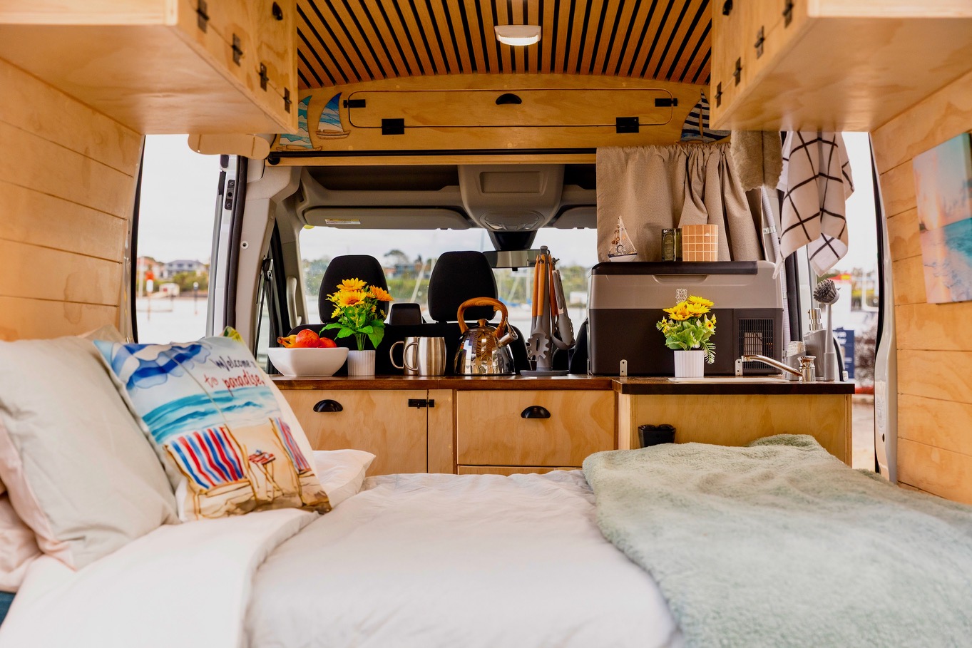 Inside a handcrafted campervan conversion showing the living area