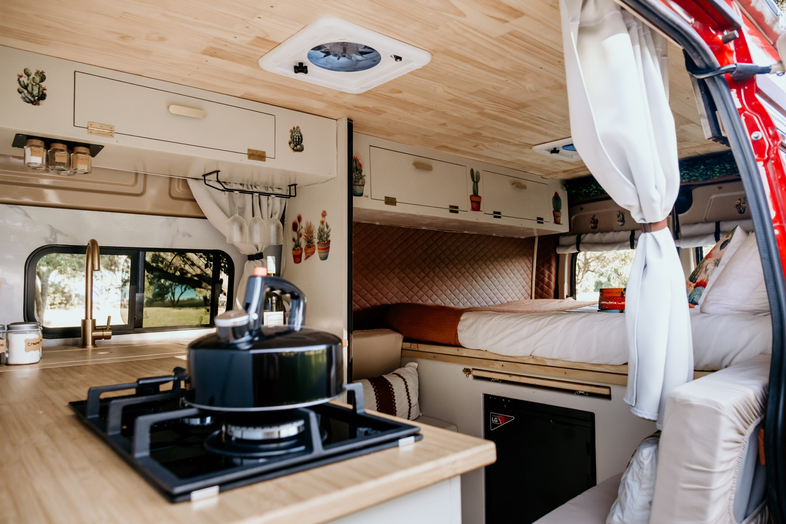 The handcrafted interior of a Quirky Campers NZ campervan