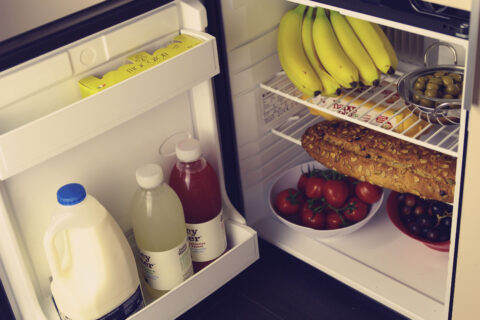 A small gas fridge on board campervan for hire from london