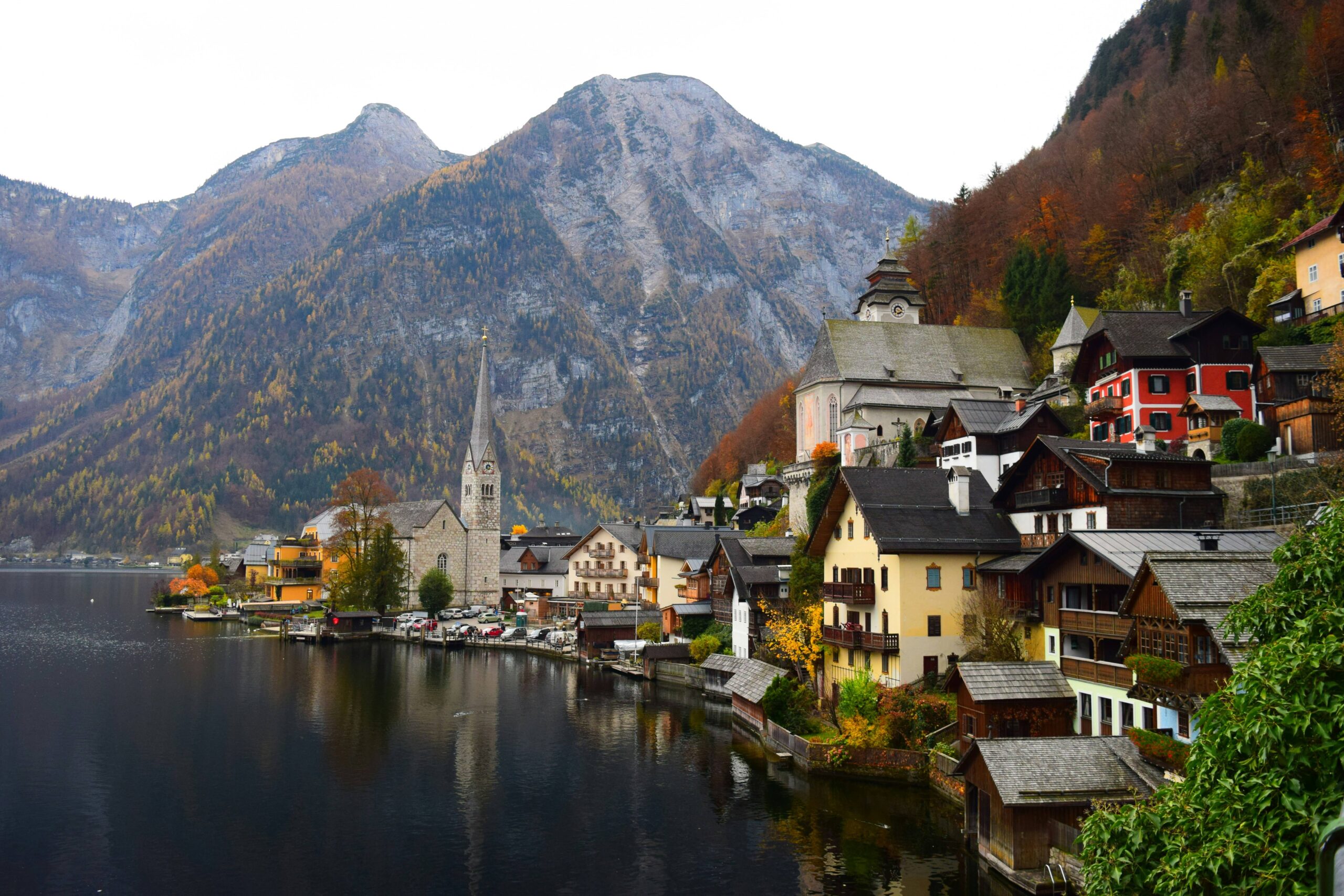 A stunning mountain range rises in the background, showcasing rugged peaks and natural beauty.