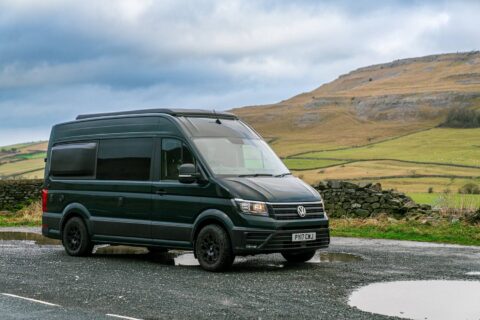 A quirky campervan parked in a rural setting